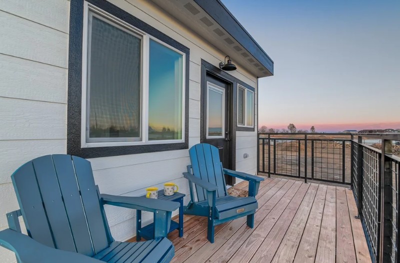 the quintessential sunset view in colorado from the upper dec of a modular-built home. affordable homes in colorado can have luxury amenities if you know how to design them right.